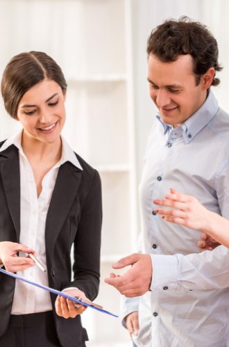 Women Showing Project To The Man On Notepad